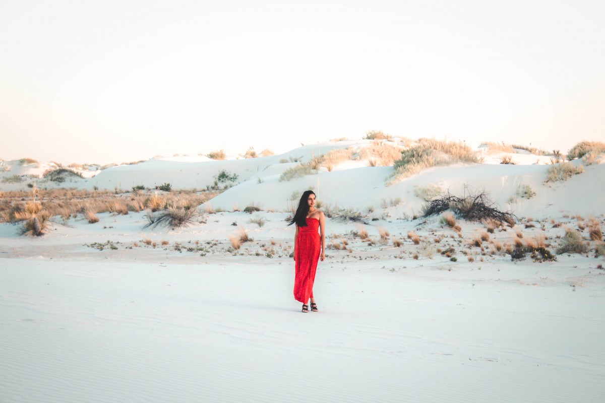 girl in red dress visiting White Sands National Park