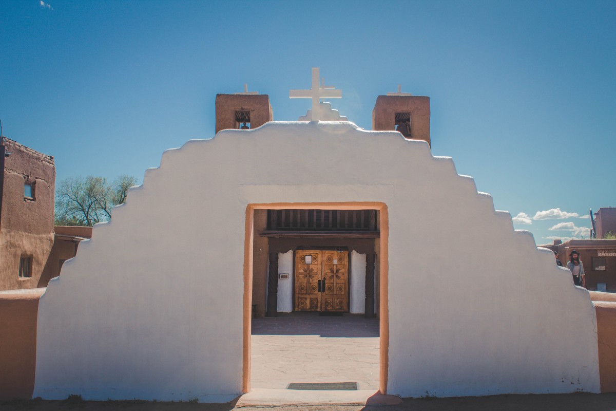 St.Jerome Church in Taos Pueblo, a unique mix of white and adobe that embodies Taos Pueblo's complex religion. 