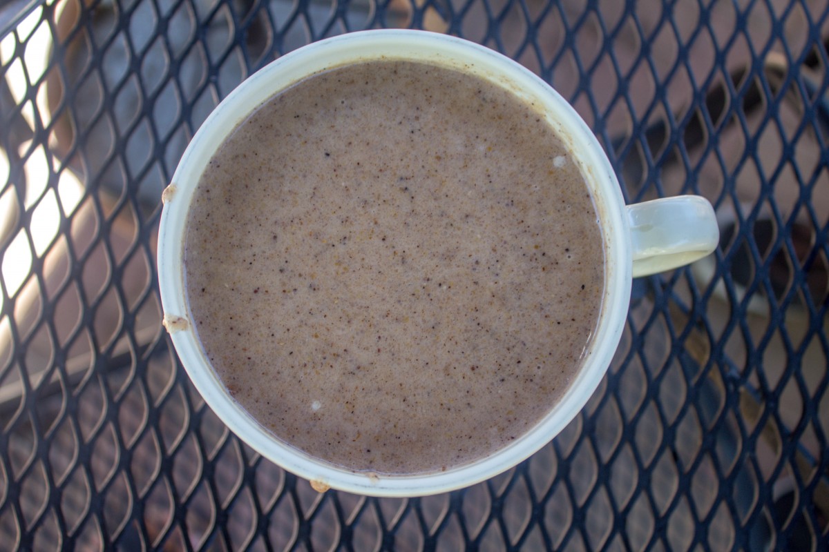 a large cup of blue corn atole, one of the most popular New Mexican foods 