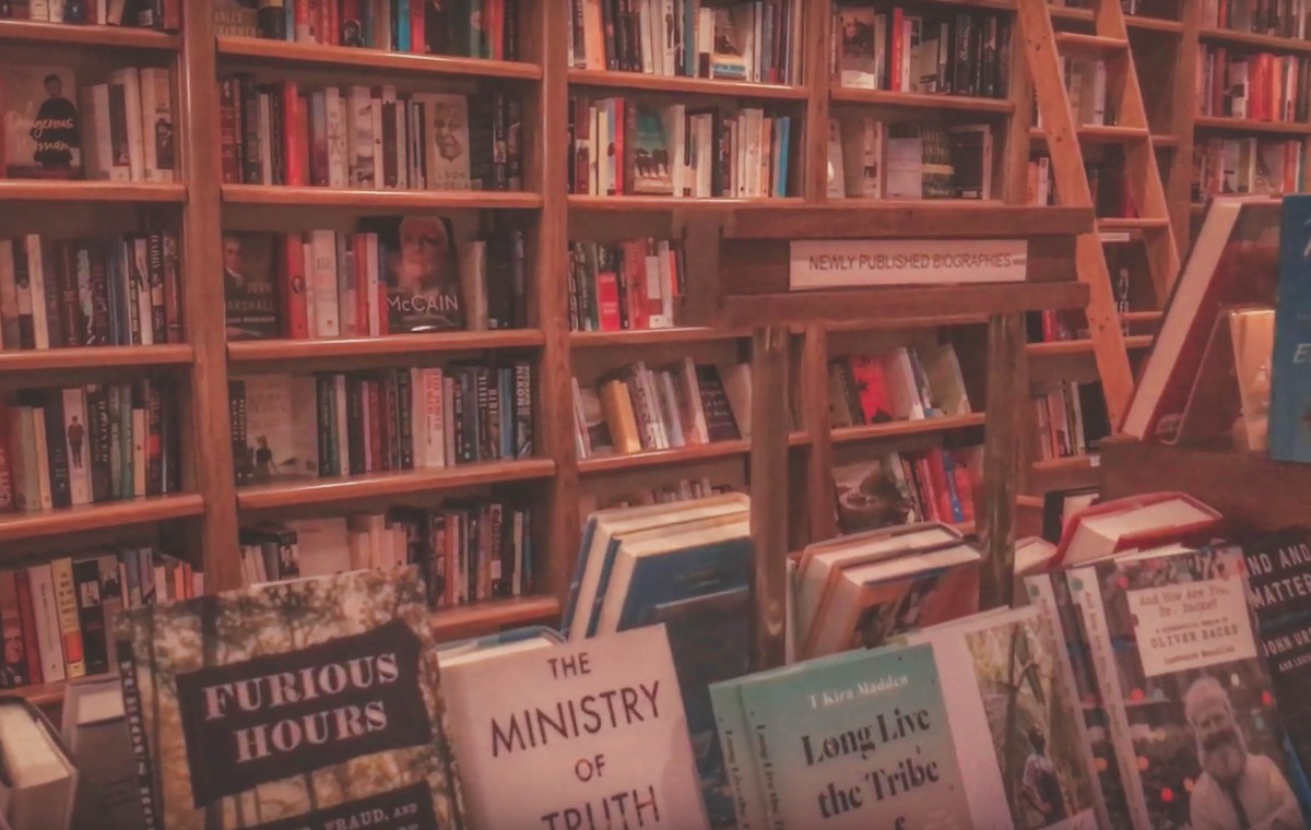 Deep oak shelves of Full Circle Bookstore in Oklahoma City