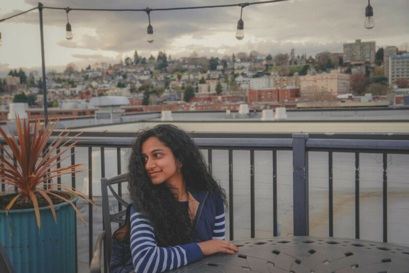 Here’s How To Care For Curly Hair While Traveling, According To A Hairstylist
