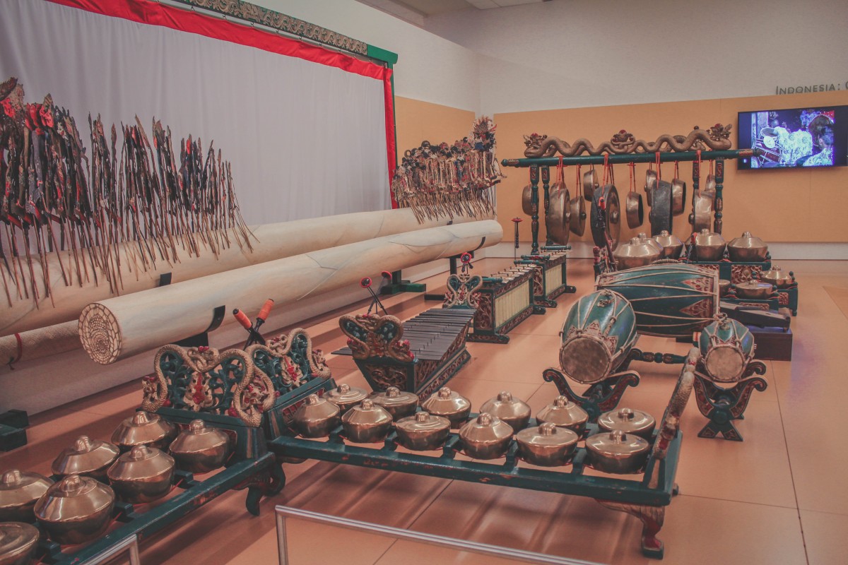 Inside MIM. A row of musical instruments all laid out in a beautiful display