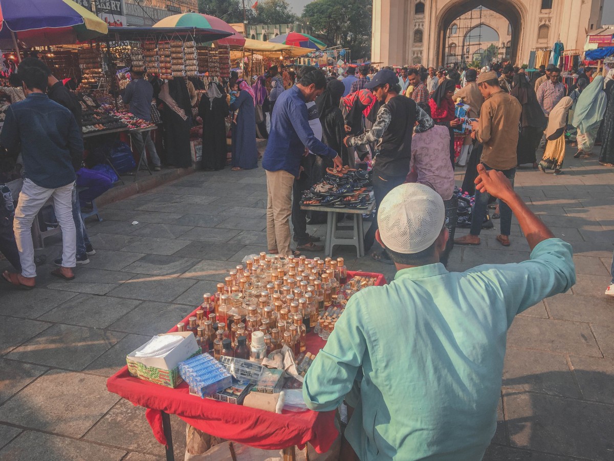 Merchant at Charminar Market selling ittar