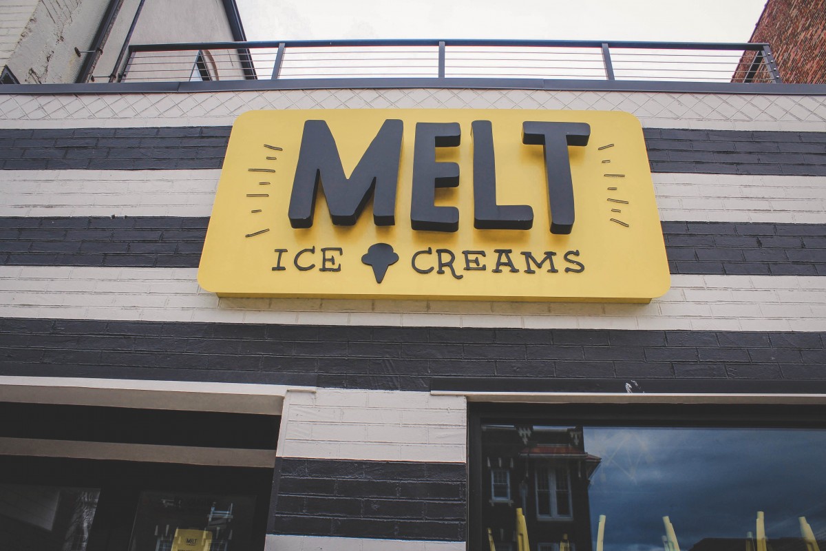 Facade of Melt Ice creams, yellow sign and striped black and white walls