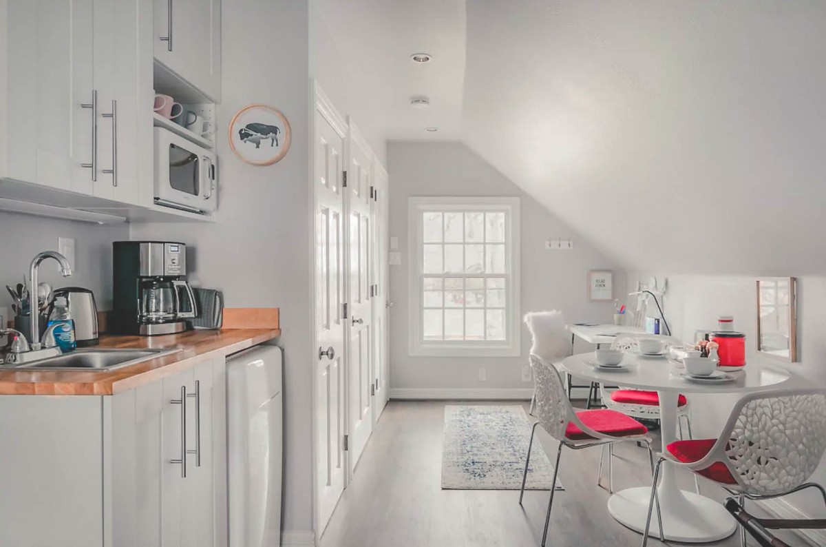 white walls, white seats, white doors at Airbnbs in Dallas - photo via Airbnb
