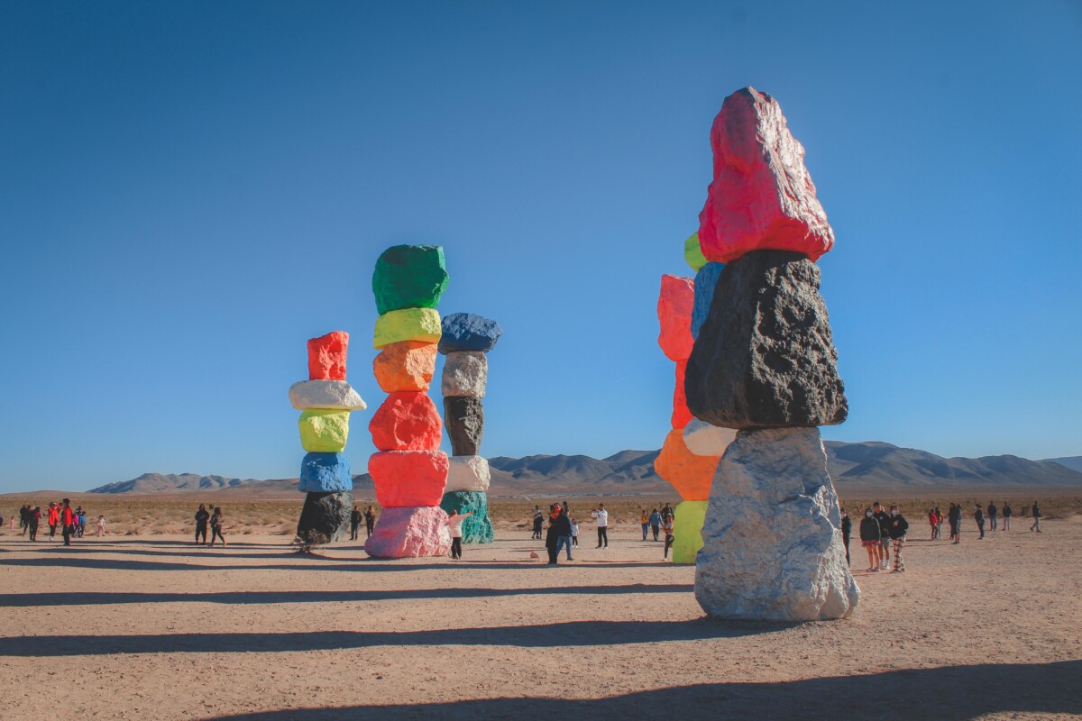 shadows spilling from Seven Magic Mountains, the iconinc painted rocks near Vegas, in the afternoon