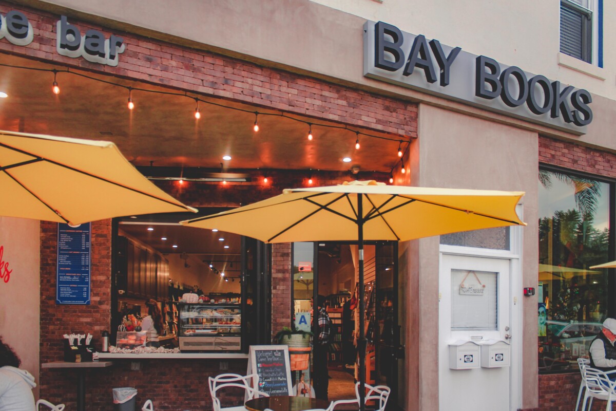 yellow umbrella-ed entrance to Bay Books Coronado, one of the best bookstores near San Diego