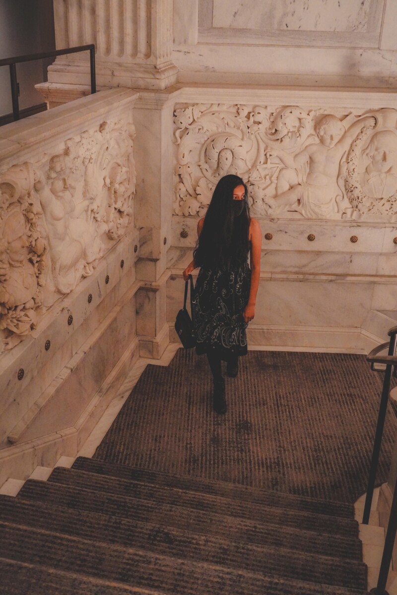 photo of the writer, staying at The Candler, walking up the stairs of The Candler Hotel