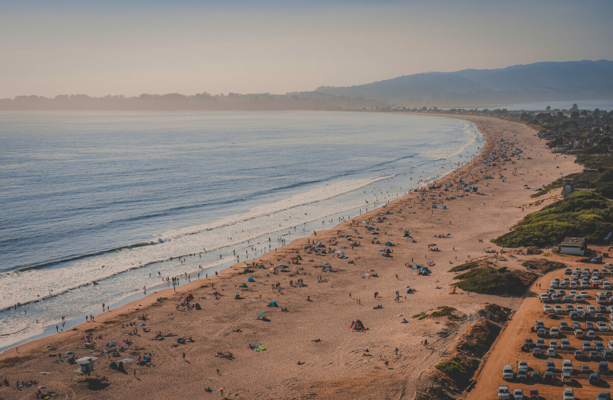 Stinson Beach, beaches near San Jose, coastline dotted with umbrellas, towels, and beachgoers