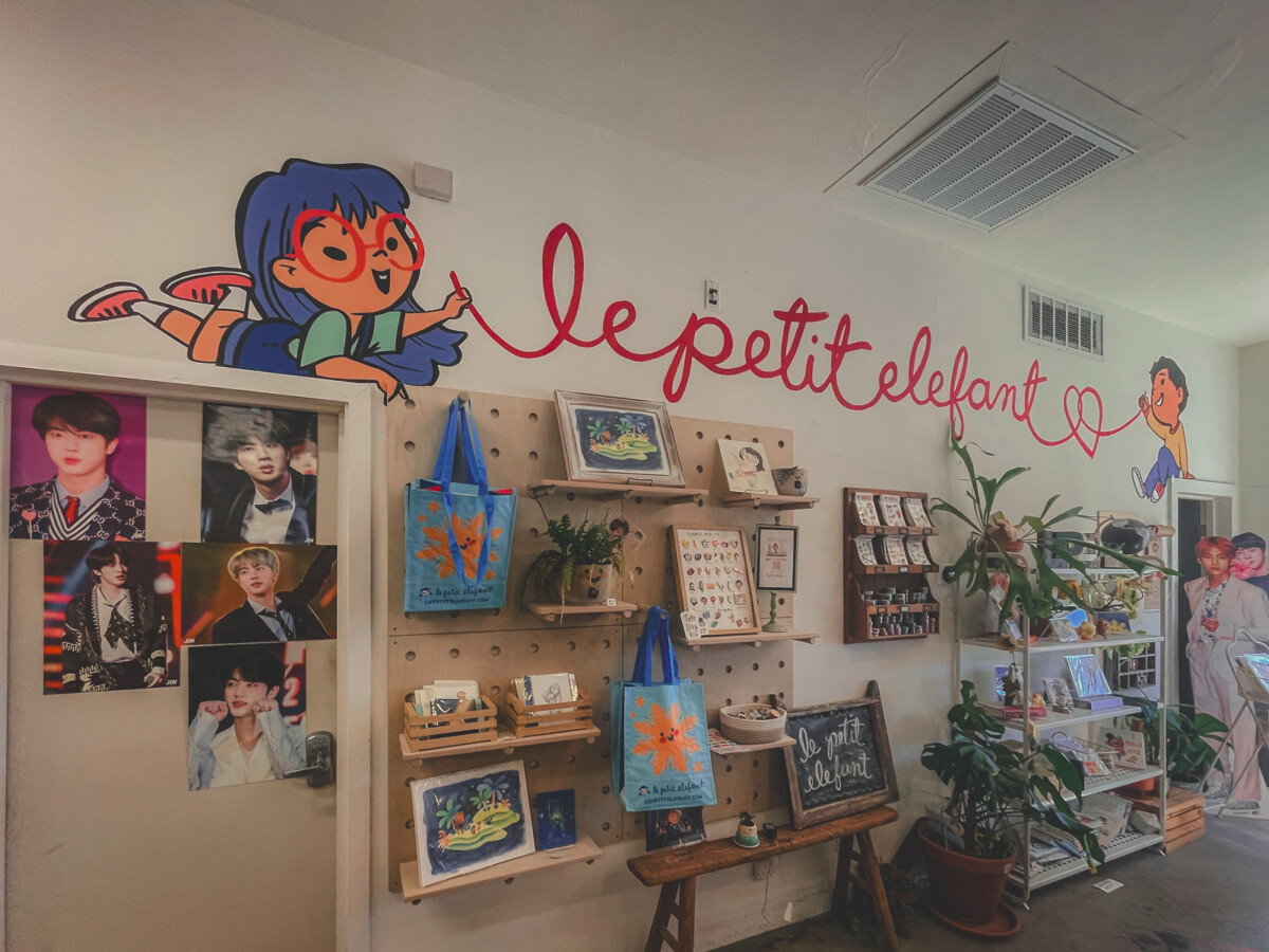 inside Le Petit Elefant with totes and BTS photos