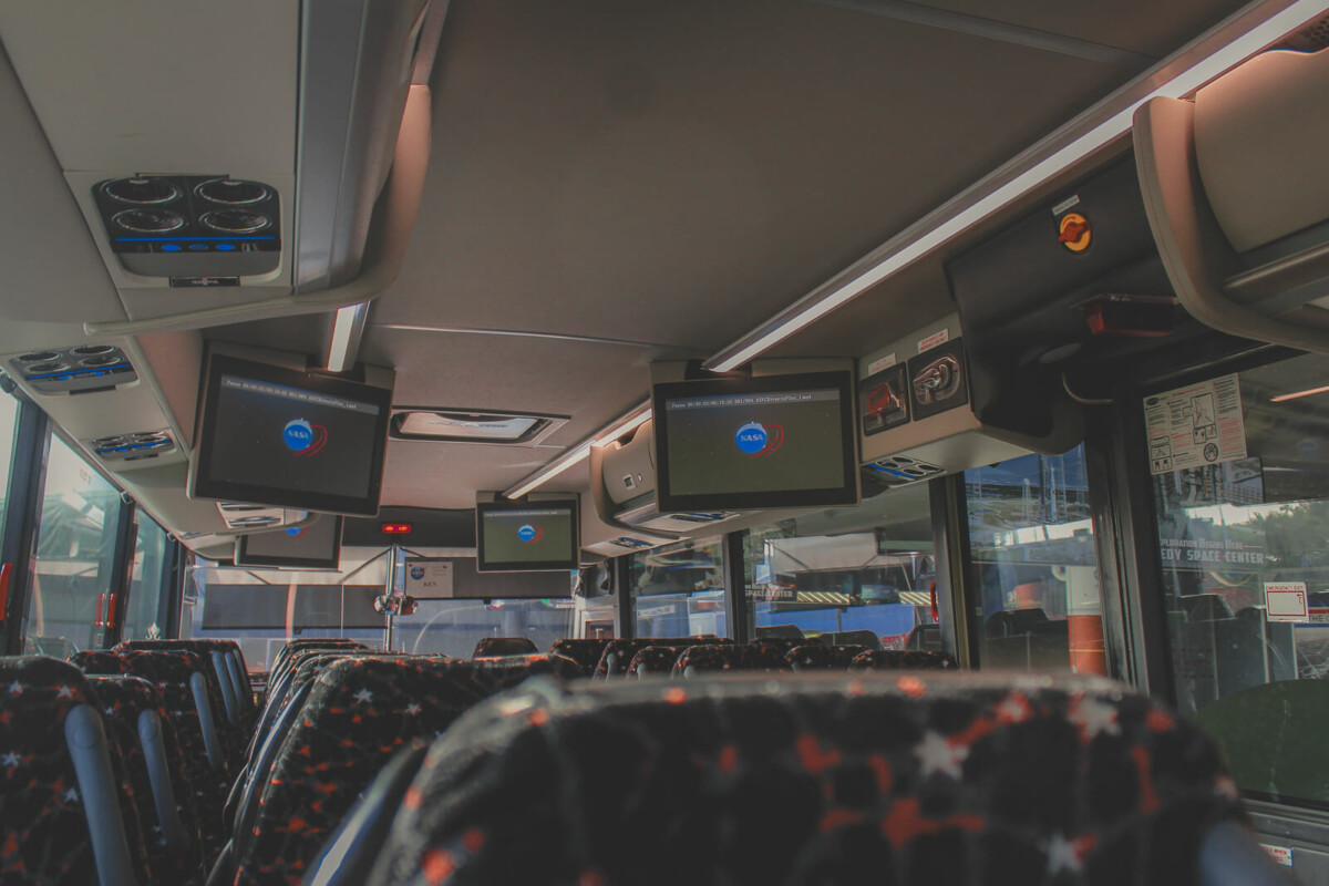 photo of the bus you'll board on the KSC bus tour; this bus has comfy seats and screens for a presentation