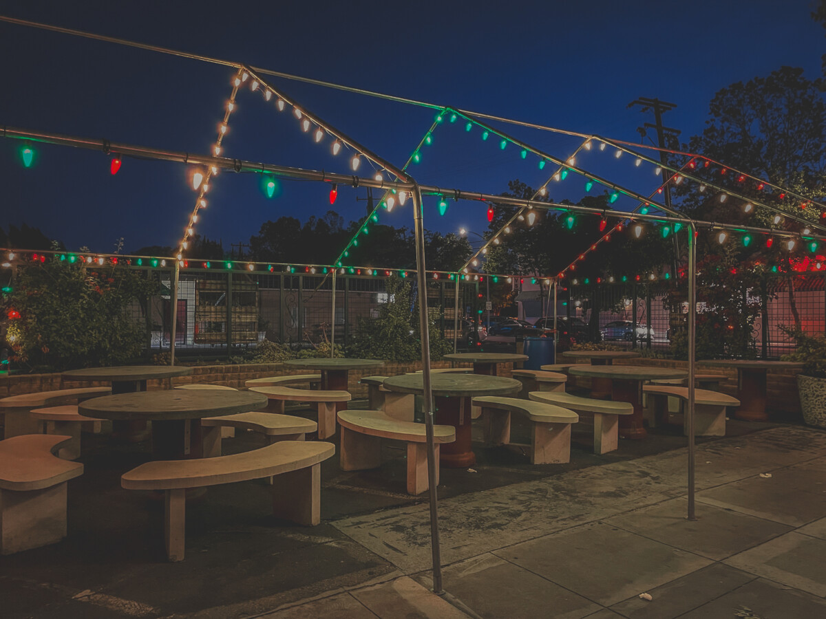 Willow Glen San Jose downtown dining option, where green and red Christmas lights are strung up over outdoor eating area