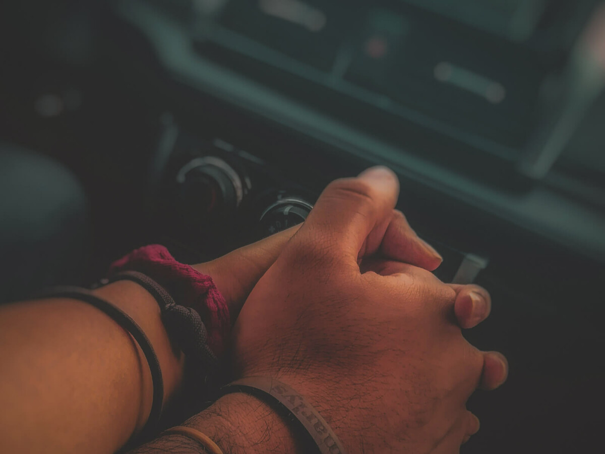 holding hands in a car