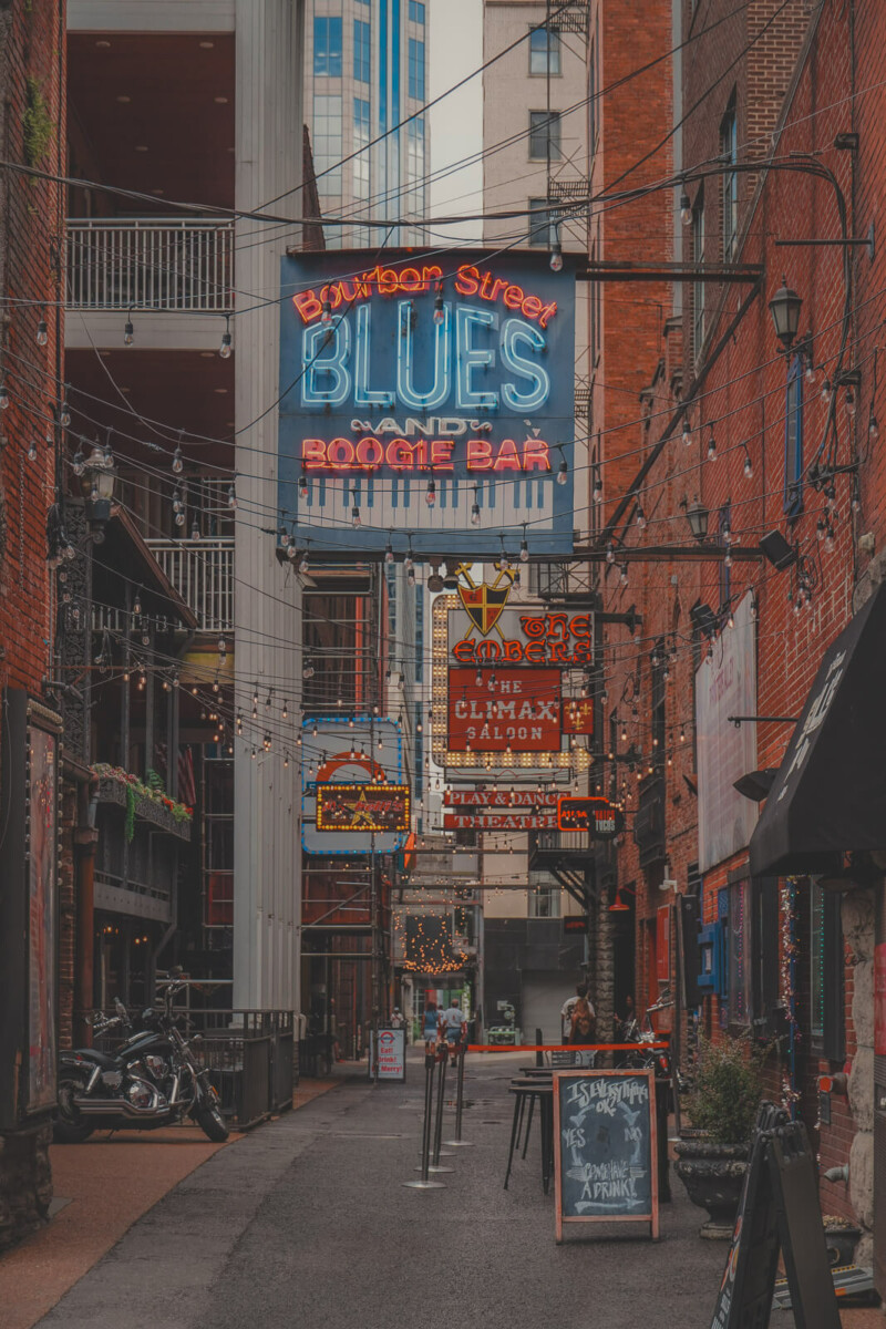 Printers Alley in Nashville, Tennessee (brick walls, signs for Bourbon Street Blues And Boogie Bar)