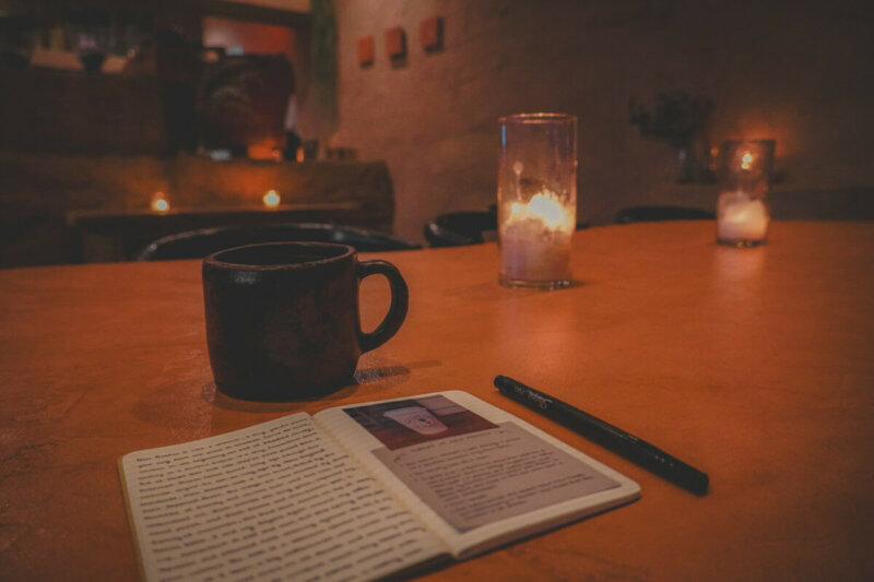 30 Travel Journal Prompts To Slow Down With featured image