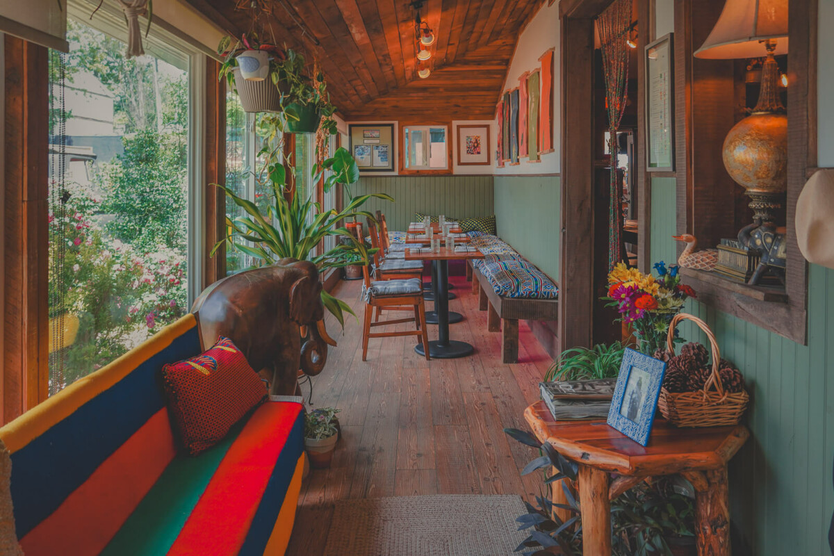 a cozy sunroom, part of a home that's been transformed into a restaurant near Asheville, North Carolina